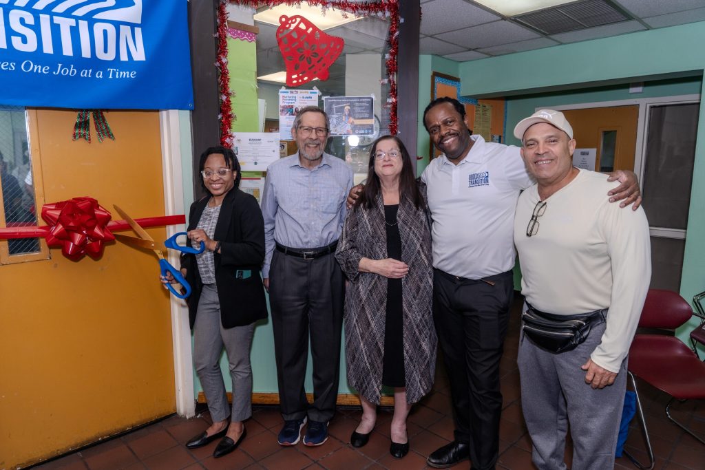 Pictured from Left to Right: Brenda Morrison, Open for Business Associate from the Miami Foundation, Alan Rauzin (son of Marvin Rauzin, the Founder of Transitions, Inc.), and his wife, Erica Rauzin, Stephen Gilmore, Executive Director of Transitions and Digital Education Student Juan Guzman at the Ribbon Cutting of the Marvin J. Rauzin Computer Lab.