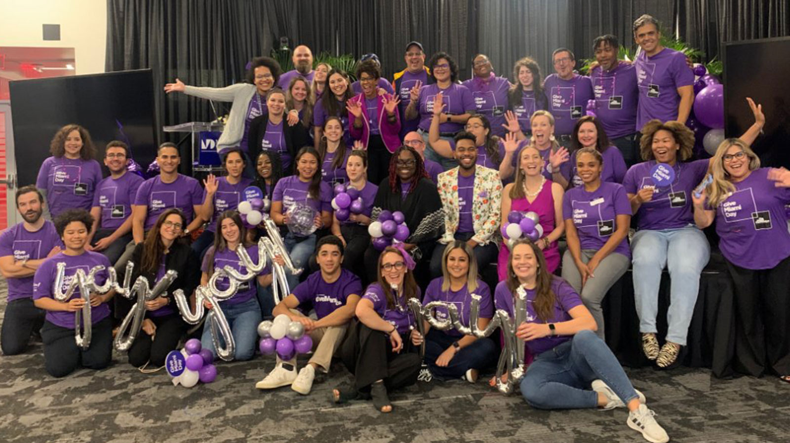 2022 Give Miami Day team smiling together