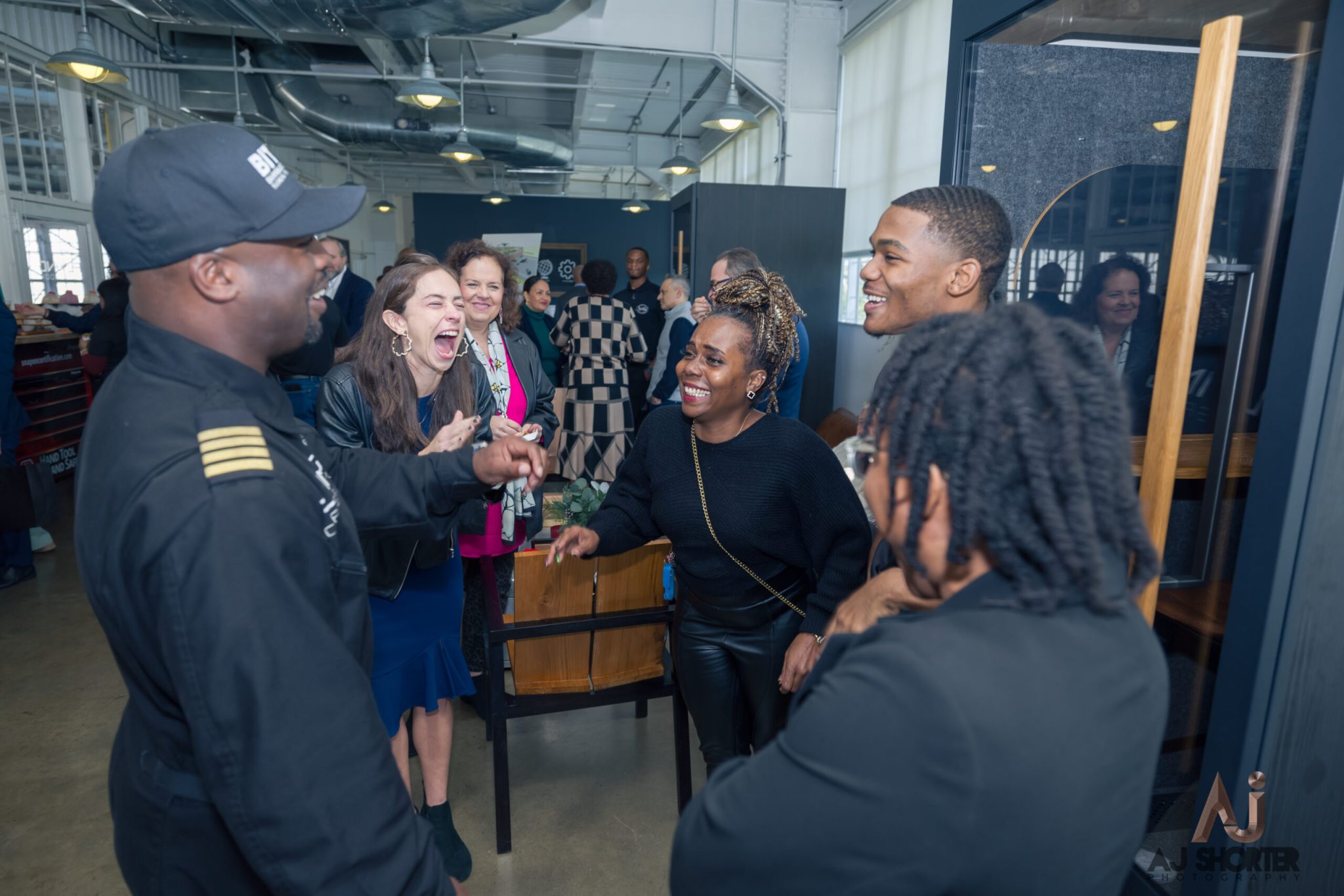 Sommer Curry, son Vontre, Brenda Morrison, and Captain Irving at the first ever graduation for the Barrington Irving Technical Training School (BITTS)