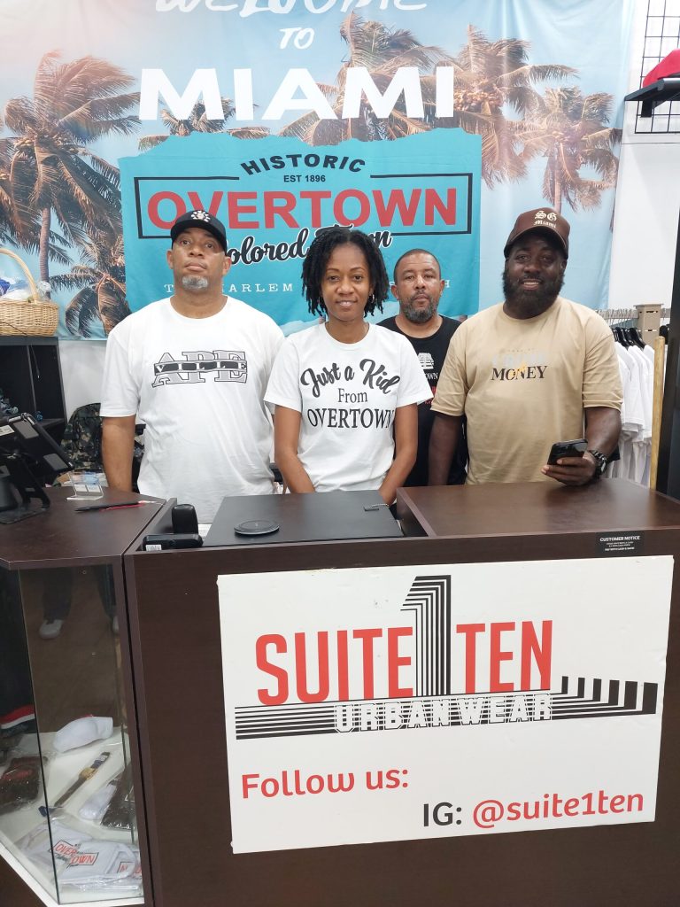 Pictured: Ultrina Harris with a few of her clients at her brick and mortar location